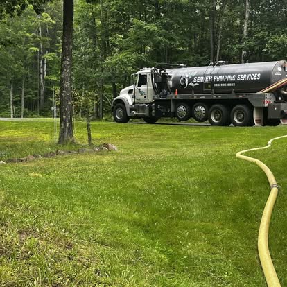 Harju tank truck pumping a septic system at a wooded property