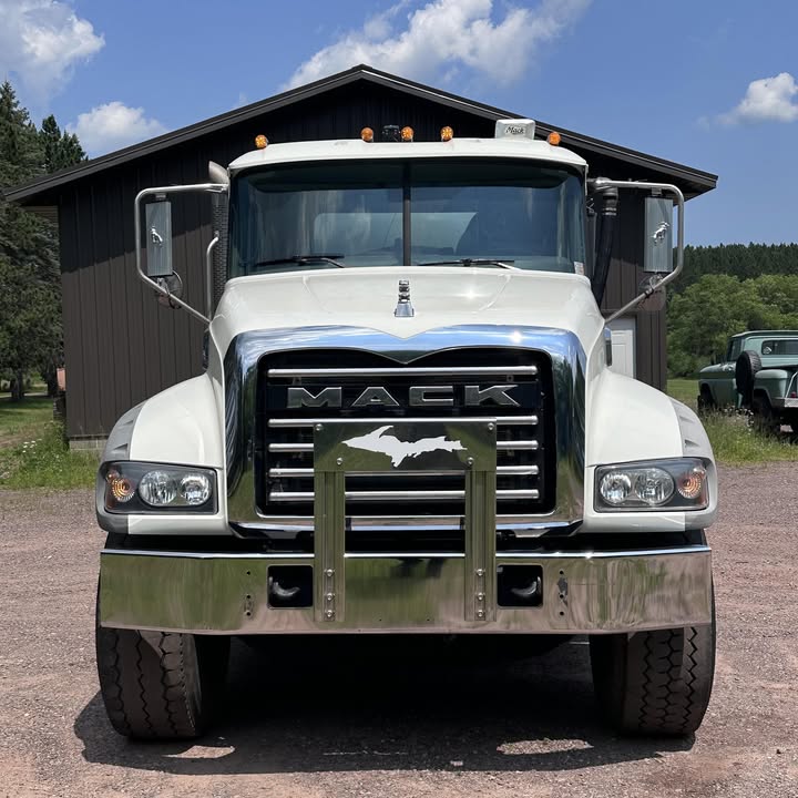Harju Septic Service Mack tank truck, head on, with a chrome Upper Peninsula emblem on the grille